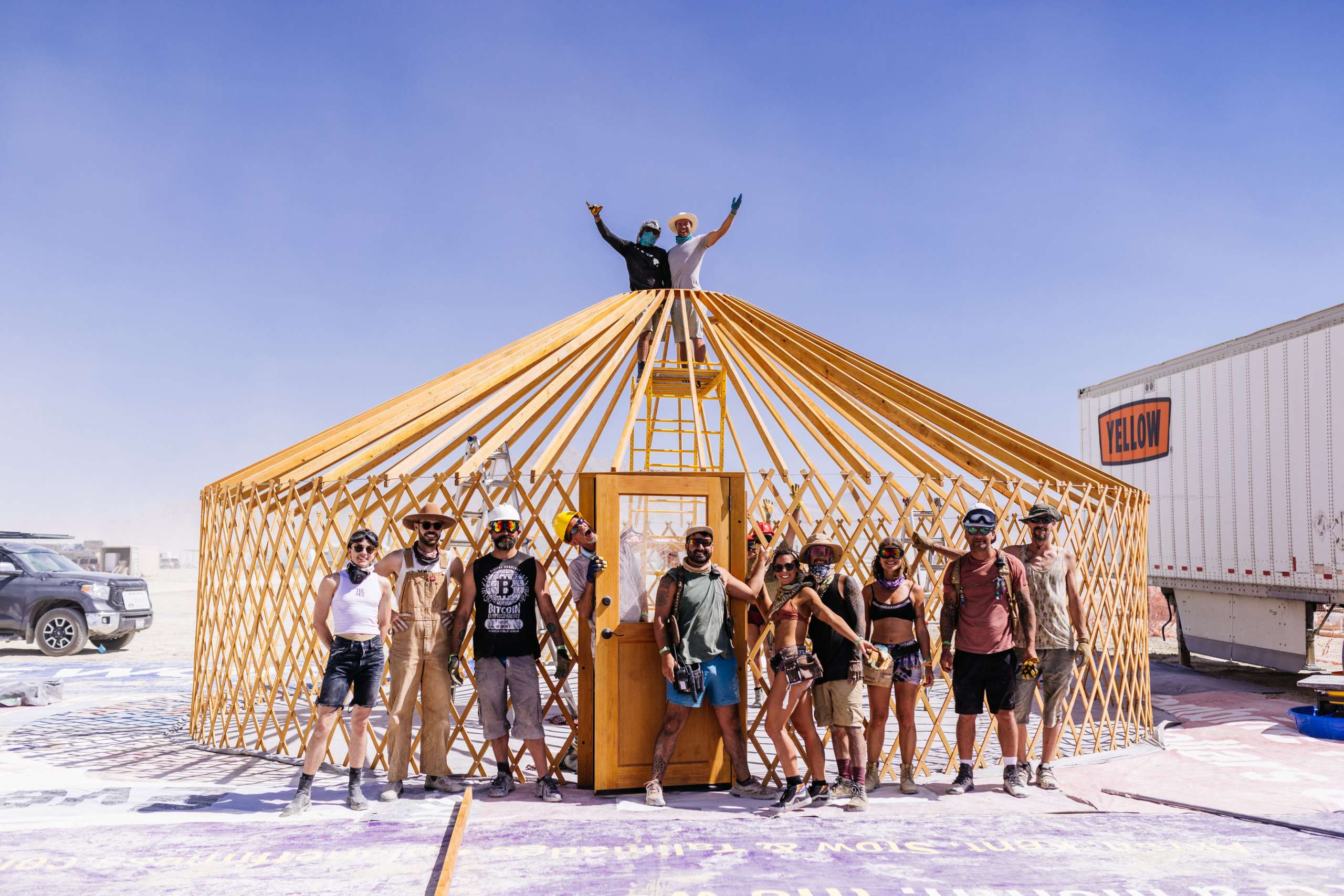 Volunteers raising a yurt at Burning Man